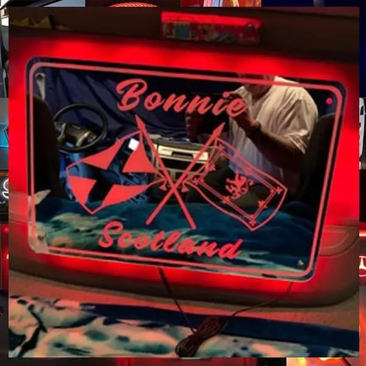 Bonnie Scotland Light Board/Bulkhead Mirror, featuring red neon edge, etched flags, and text, designed for 12/24V vehicles. Includes remote-controlled RGB lighting.
