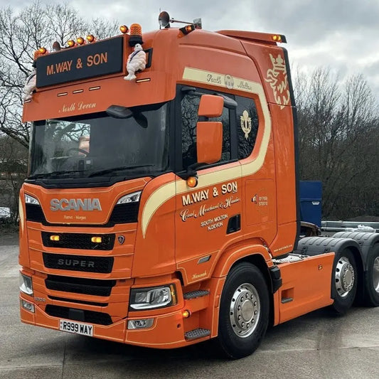 Michelin Man Mascot Headboard Mounts (Pair) on an orange Scania truck, showcasing stainless steel brackets for easy mascot attachment without extra drilling.
