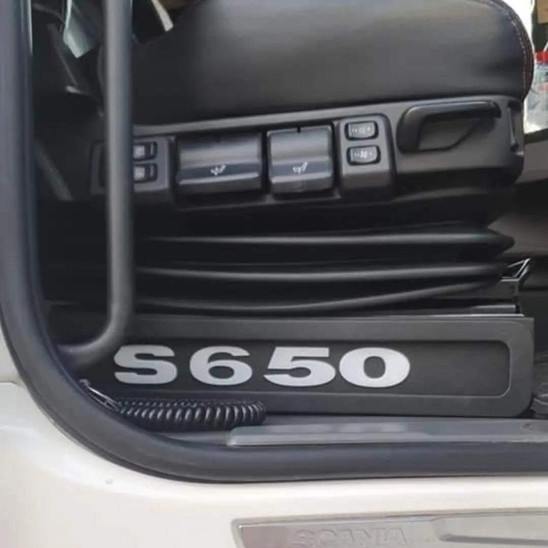Scania Next Gen S650 LED Seat Bases with RED LED, featuring model badge, Scania logo, air-suspension bellows, and seat adjustment switches visible.