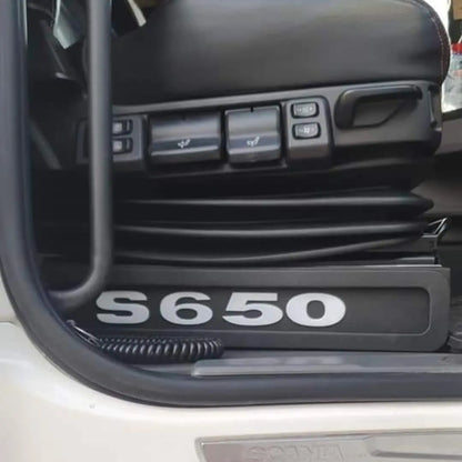 Scania Next Gen S650 LED Seat Bases with RED LED, featuring model badge, Scania logo, air-suspension bellows, and seat adjustment switches visible.
