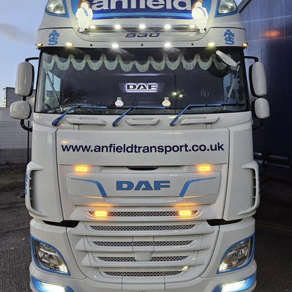 Front view of a white DAF tractor unit by Anfield Transport, showcasing the illuminated DAF 3D Truck Light Board with custom blue trim around headlights.