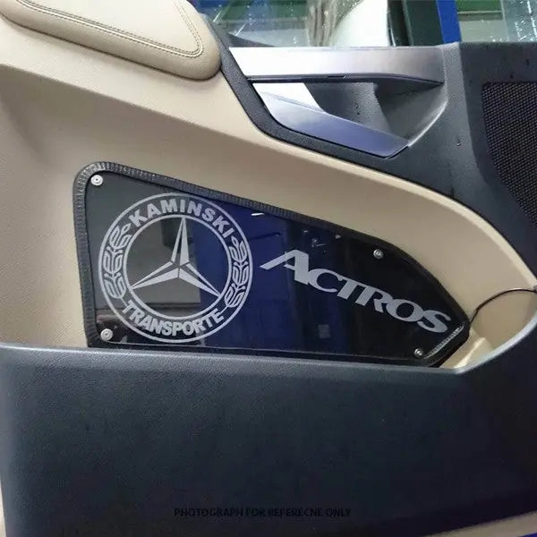 Mercedes Actros Led Custom Interior Door Panels featuring a custom acrylic nameplate with Kaminski Transporte logo, integrated into the trim for enhanced truck interior styling.