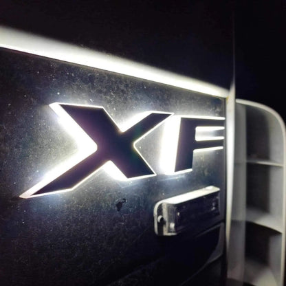 Close-up of the chrome XF model badge with back-lighting on a car, representing the DAF Euro 5 LED Name Badge for 24V vehicles.