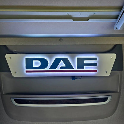 DAF 3D Truck Light Board illuminated with DAF and red underline, mounted inside a truck cab, showcasing a stylish, customizable RGB LED display for enhanced interior aesthetics.