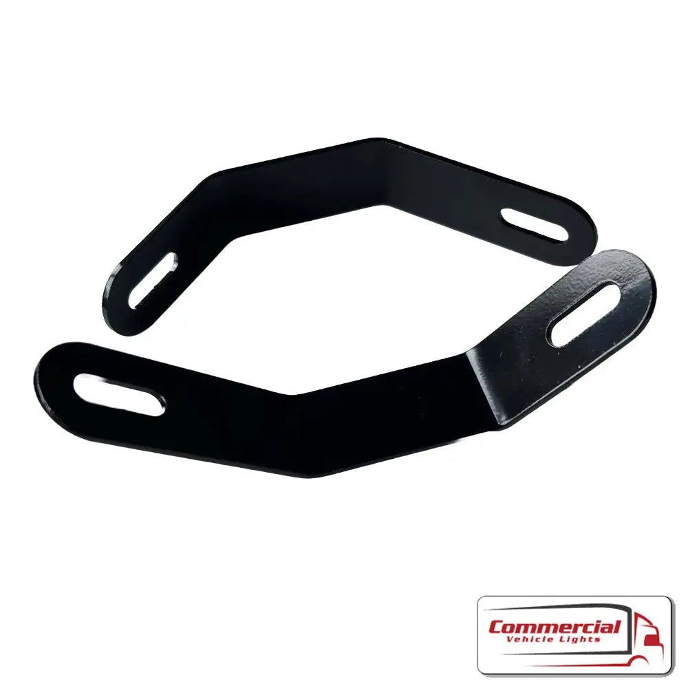 FH Step Work Light Mounts (Pair) for Volvo; hexagonal black steel brackets with slotted holes, designed for easy, secure installation on Volvo FH truck steps.