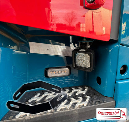 FH Step Work Light Mounts (Pair) visible on truck step with LED lights, reflective tape, and mounting bracket, designed for Volvo FH models, emphasizing durability and easy installation.