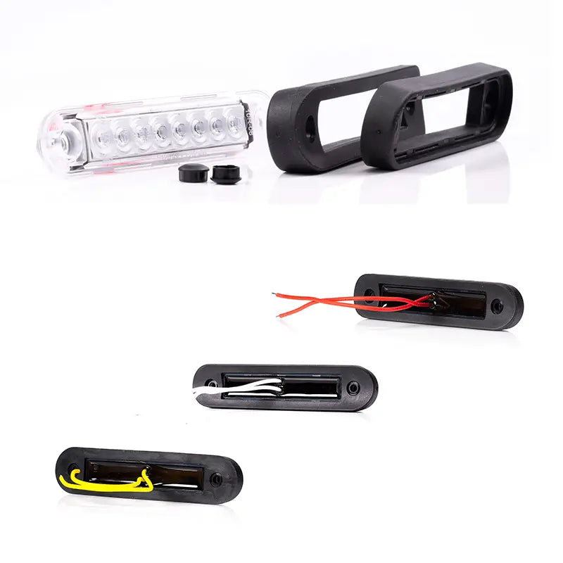 Fristom Long Marker Light FT-073 with clear-lens LED bar and three flush-mount LED pods, featuring rubber grommets and mounting sleeves, ideal for vehicles and boats.