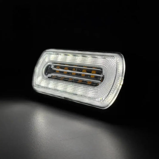 Amber HALO Strobe Warning Lamp R65 with a clear lens, featuring high-intensity white and amber LEDs for vehicle visibility and safety, suitable for 12/24v systems.