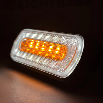 Amber HALO Strobe Warning Lamp features amber LEDs with a clear, textured lens, surrounded by white LEDs, ideal for automotive signaling and marker lighting.