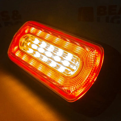 Amber HALO Strobe Warning Lamp with translucent red lens, showcasing bright grid of LEDs, ideal for diverse vehicle lighting applications with compact design and dual voltage capability.
