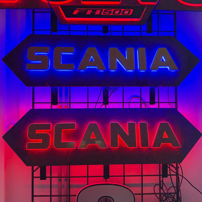 Scania Infill Panel LED Truck Light Board by TLD 24 Volt, featuring illuminated SCANIA and FH500 signs on a metal display rack.