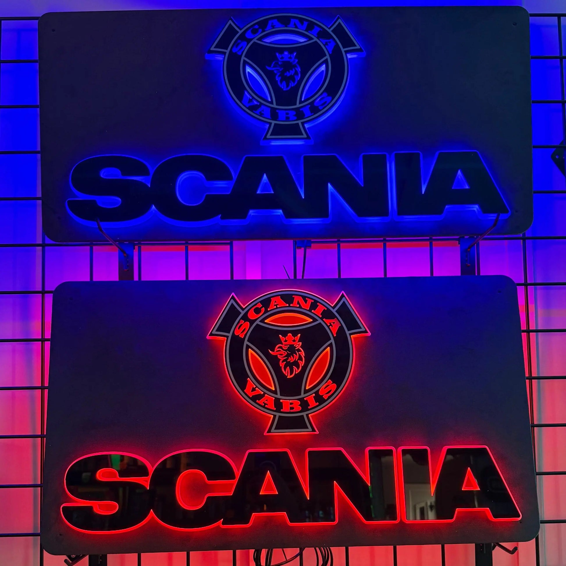 Scania Infill Panel LED Truck Light Board by TLD 24 Volt, featuring blue and red back-lit metal signs with Scania emblem, on a display rack.
