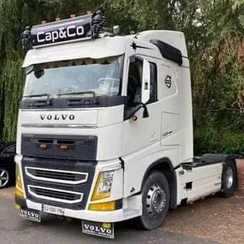 White Volvo semi-tractor with Cap&Co sign, showcasing a 105x30x15cm Standard Dutch Style Illuminated LED Headboard (White LED) for truck customization.