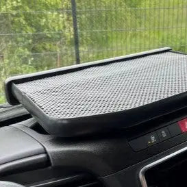 RENAULT MASTER LED Dash Table (2020-On) with a black non-slip mat on the dashboard, visible climate-control vents, and a fence outside the windshield.
