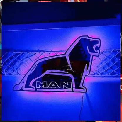 Stylized lion logo glowing, representing MAN Interior Truck Mirror for commercial vehicles, featuring LED RGB lighting and remote control for custom interior styling.