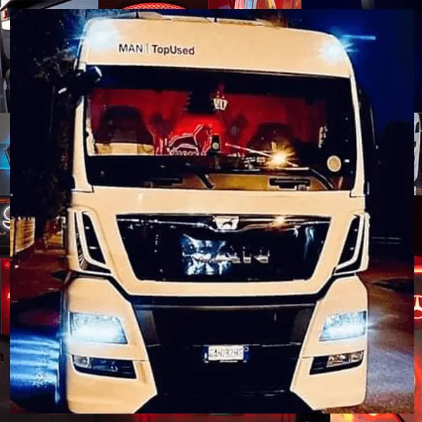 Front view of a white MAN semi-truck at night, highlighting MAN Interior Truck Mirror with LED RGB lights, visible through the windshield.