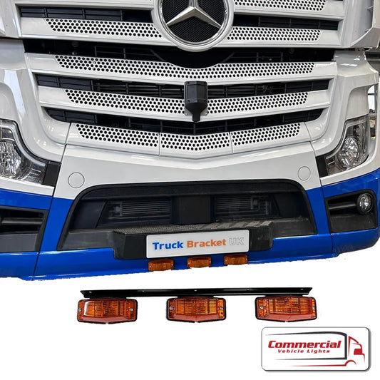 Mercedes Actros Double Burner Bumper Mount showcased on a truck with three amber lamps, highlighting its durable, sleek design and compatibility with auxiliary lighting.
