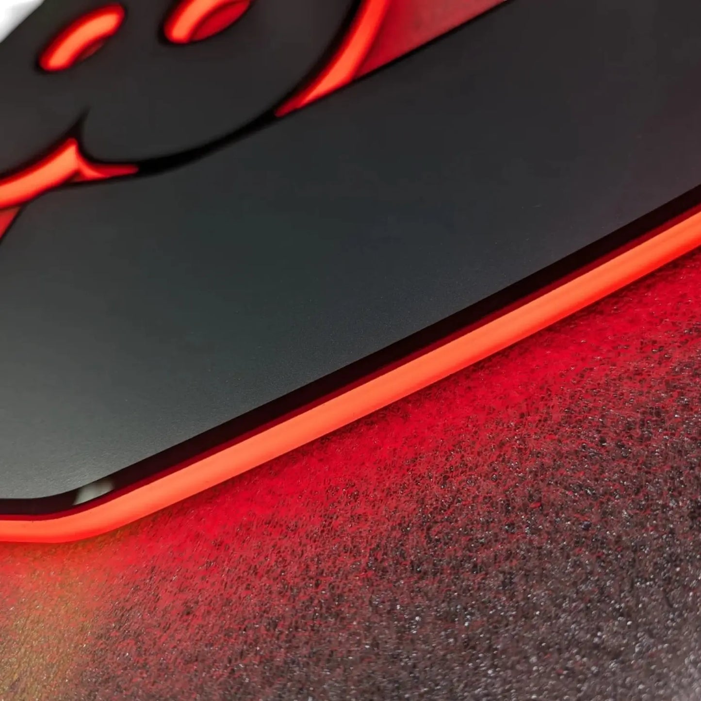 Scania Infill Panel LED Truck Light Board by TLD, featuring a black base with a red LED strip casting a soft glow on a textured surface.