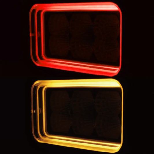 Boreman Work Lamp 1001-1515 with red and amber 'Tunnel Effect' position light, featuring glowing rectangular frames against a dark background, showcasing its futuristic design.