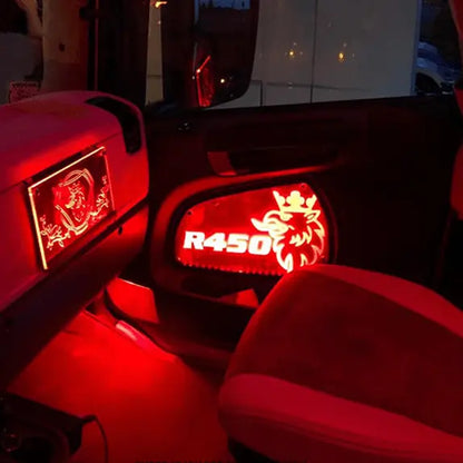 Scania Led Interior Door Panels P-G-R-S Series with red LED-lit acrylic inlays illuminate the R450 cab's interior, highlighting the griffin emblem and model designation.