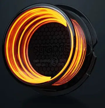 Strands FOR9T Geo Outline Marker Lights, orange illuminated wire neatly coiled on a black reel, showcasing the flexible, glowing light-strip design.