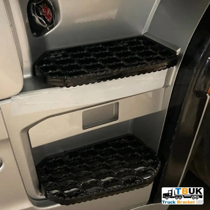 Close-up of Scania truck cab showing aftermarket non-slip steps; includes the Next Gen R/S Series Step Infill Panel with Side Marker Light, featuring durable honeycomb-patterned treads.
