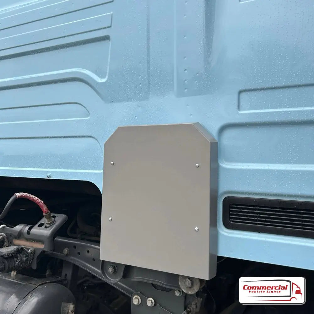 Next Gen R/S Series Cab Mount/Air Bag Cover Kit on a light-blue truck, featuring a grey steel mounting plate for auxiliary lamps, enhancing durability and style.