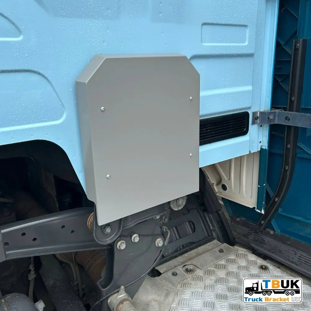 Next Gen R/S Series Cab Mount/Air Bag Cover Kit in stainless steel, installed in a tilting-cab truck, enhancing and protecting cab mounting area.