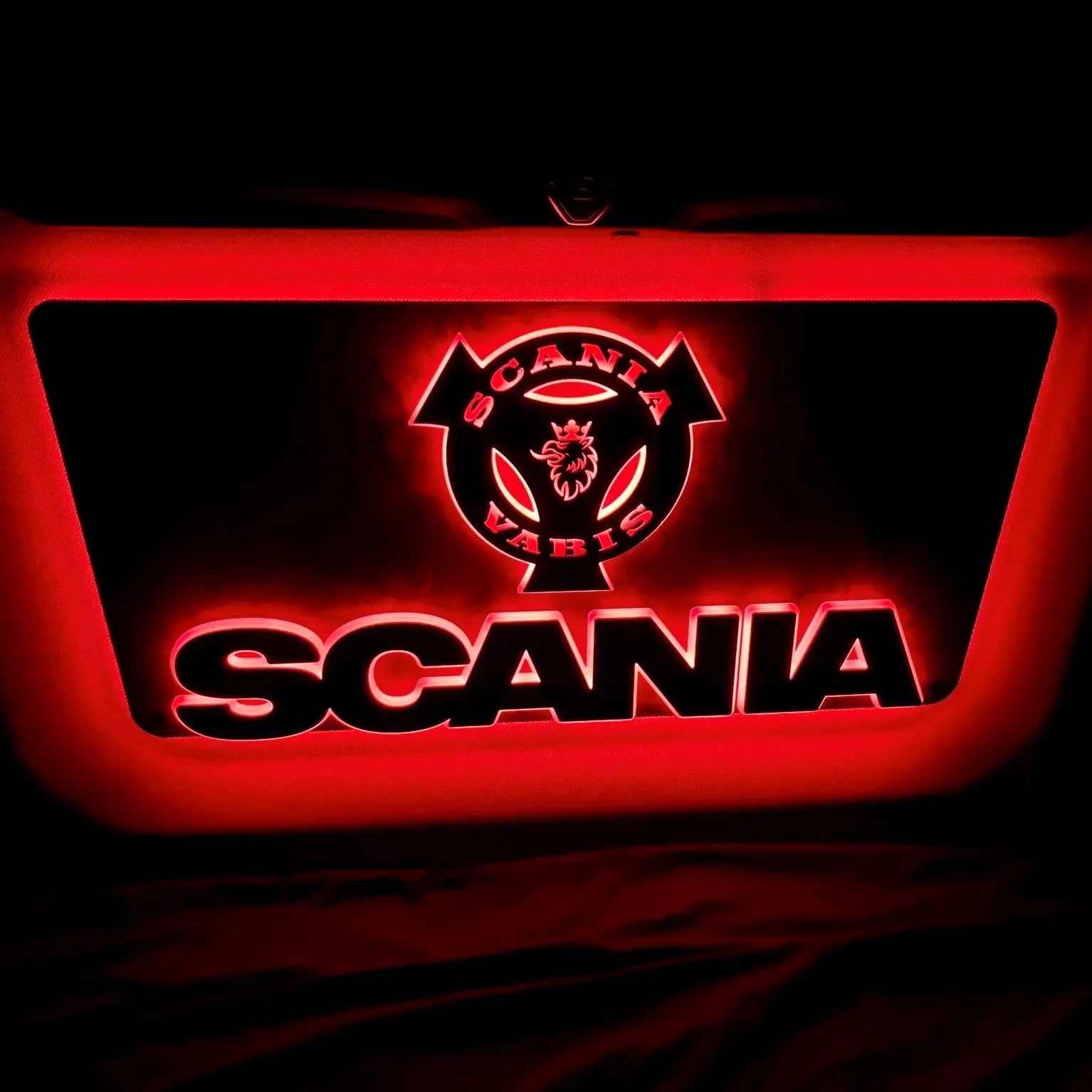 Scania Infill Panel LED Truck Light Board featuring the Scania-Vabis griffin emblem, illuminated in red neon against a dark background, enhancing truck cabin aesthetics.