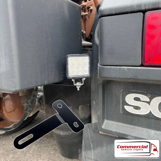 Scania Next Gen Rear Chassis Work Light Mounts (Pair) shown mounted on a truck, featuring a rugged LED array and loose L-shaped bracket.
