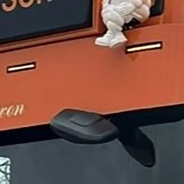 Close-up of a truck's rear with a rope and marker lights, showcasing where the Deep Visor Mirror Extension fits for streamlined sun visor installation.