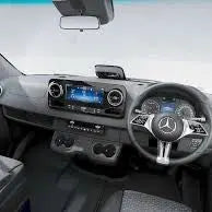 Driver's-side view of a Mercedes Sprinter featuring the MERCEDES SPRINTER LED Dash Table, enhancing dashboard aesthetics with integrated LED lights and storage.