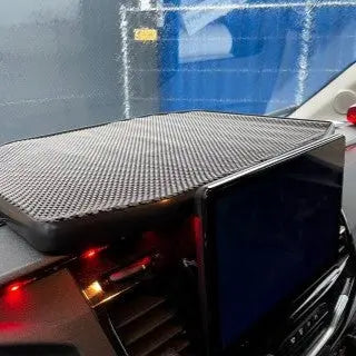 FORD TRANSIT LED Dash Table (2018-23) with anti-slip mat, pop-out touchscreen mount, red LEDs, and air vents, offering storage and convenience for vehicles.