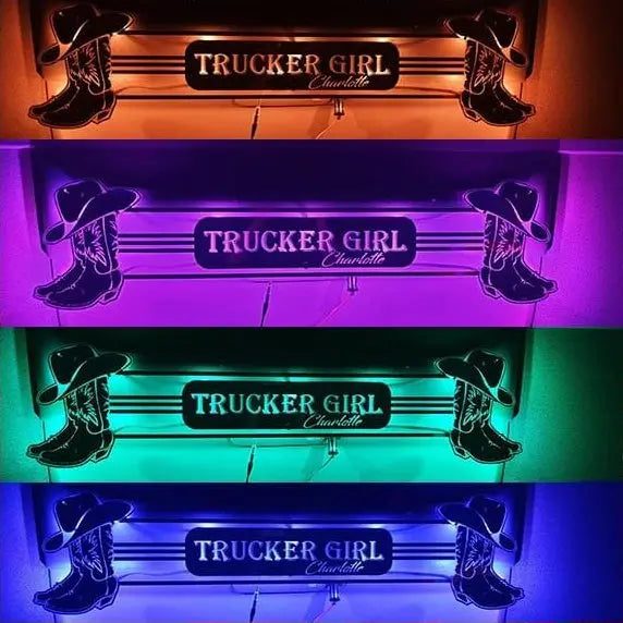 TRUCKER GIRL BULKHEAD MIRROR LIGHTBOARD 1000x250mm featuring illuminated sign with TRUCKER GIRL Charlotte and cowboy boot accents, shown in four different LED colors.