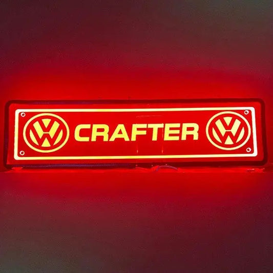 Illuminated VW Crafter Plexi Glass Light Board featuring two VW logos and CRAFTER text, designed for truck cabins with RGB lighting and remote control.