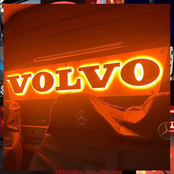 Scania R/S Series Truck Light Board in showroom, featuring illuminated VOLVO sign and Mercedes-Benz logos, highlighting its multi-brand compatibility and stylish truck cabin upgrade.