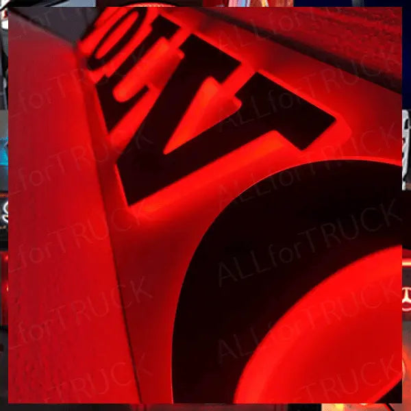 3D letters with red LED back-lighting, forming the MAN 3D Truck Light Board, featuring black letter faces and a bright red halo glow.