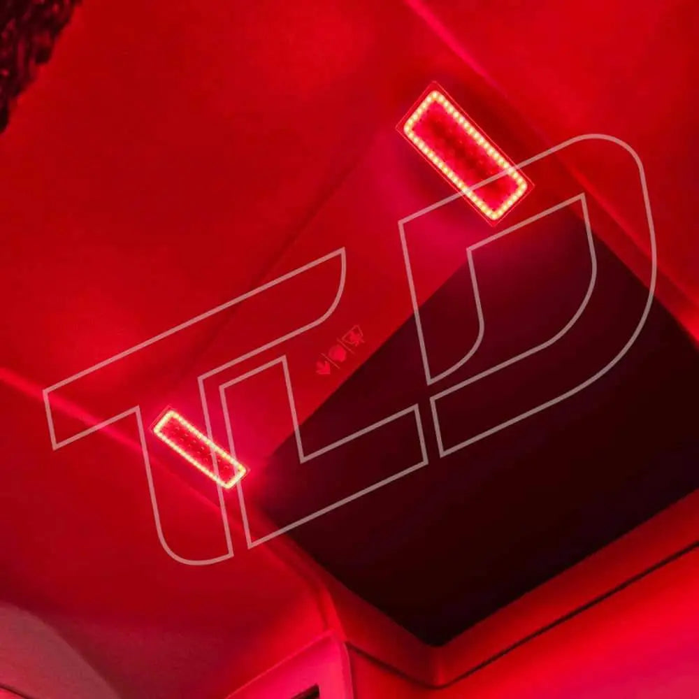 Volvo FM/FH Version 5 Interior Lights: Vehicle cabin ceiling featuring dual-color LED modules and central panel, all bathed in ambient red light.
