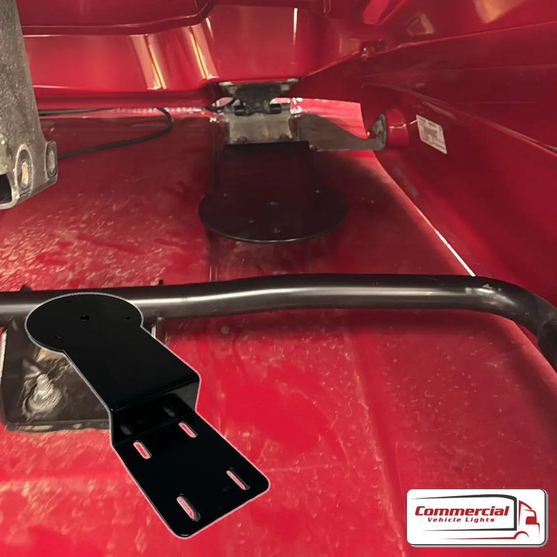 Volvo FH XL Air Kit Beacon Mounts shown inside a red van, featuring black metal bracket with holes for light assembly, designed for durable, stylish installation.