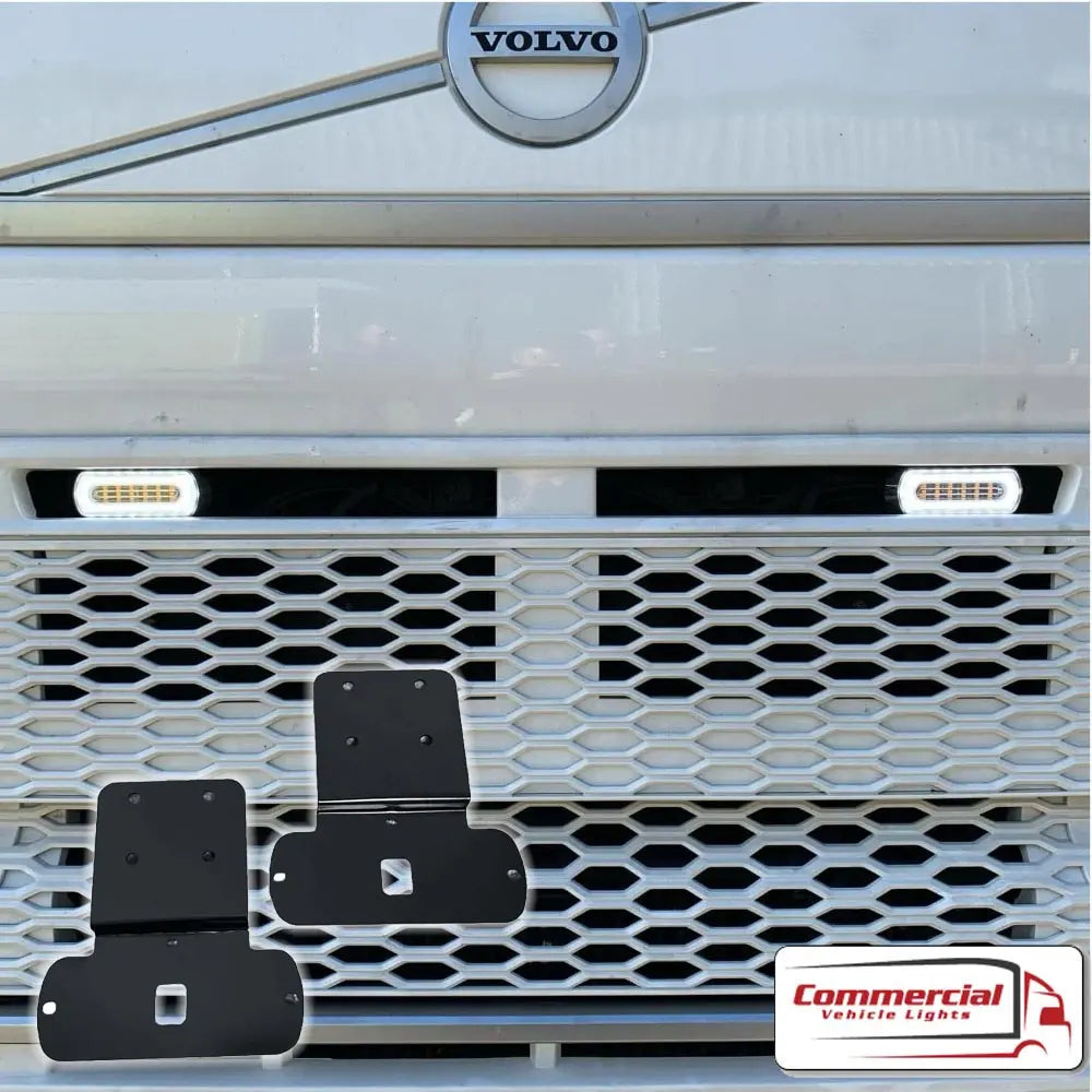 Volvo FH V5 Halo Strobe Light Grill Mounting Brackets shown with black metal brackets and LED marker lights, highlighting secure grill installation for enhanced visibility.